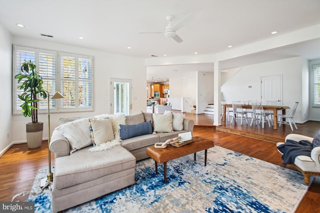 61 E Lake Dr, Annapolis, MD 21403 - living area featuring visible vents, wood finished floors, a ceiling fan, and stairs