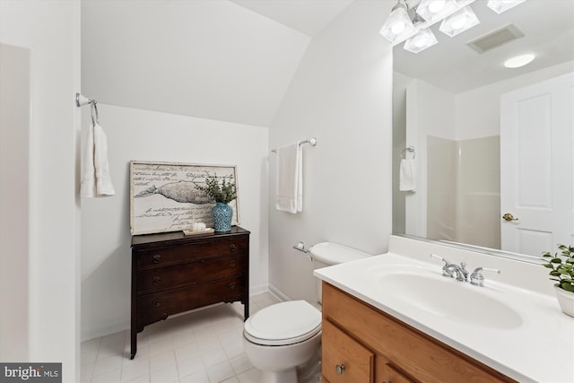 61 E Lake Dr, Annapolis, MD 21403 - bathroom with vanity, toilet, visible vents, vaulted ceiling, and baseboards