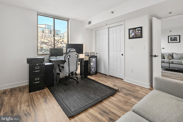 1276 N Wayne St Unit 408, Arlington, VA 22201 - office space with beverage cooler, wood finished floors, visible vents, and baseboards