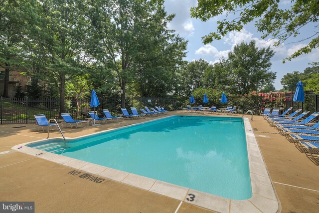 1276 N Wayne St Unit 408, Arlington, VA 22201 - pool featuring fence and a patio area