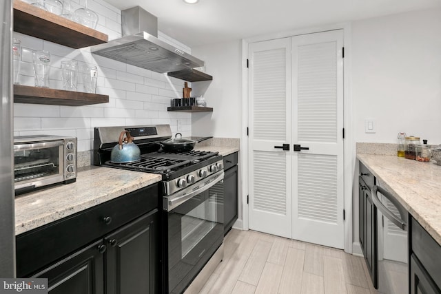 1276 N Wayne St Unit 408, Arlington, VA 22201 - kitchen with wall chimney range hood, open shelves, appliances with stainless steel finishes, and decorative backsplash