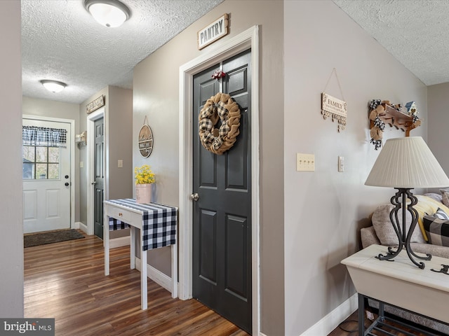 2796 Green Spring Rd, Winchester, VA 22603 - entrance foyer with baseboards, wood finished floors, and a textured ceiling