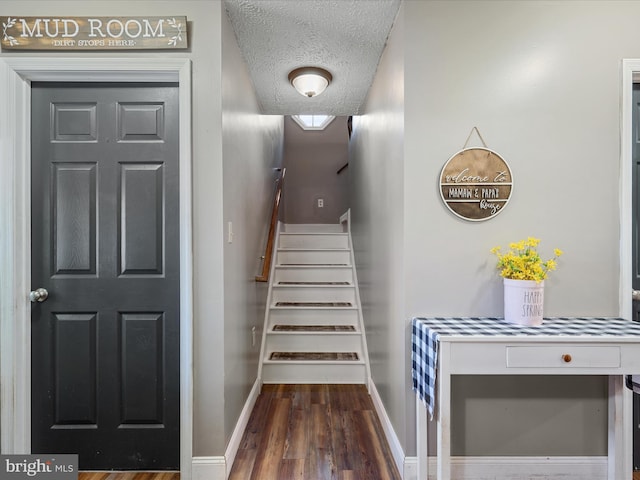 2796 Green Spring Rd, Winchester, VA 22603 - stairs featuring baseboards, wood finished floors, and a textured ceiling
