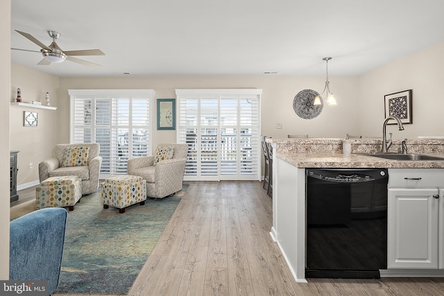 12301 Jamaica Ave Unit E21605, Ocean City, MD 21842 - kitchen featuring open floor plan, a sink, ceiling fan, black dishwasher, and wood finished floors