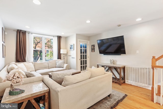 living area with recessed lighting and light wood-type flooring