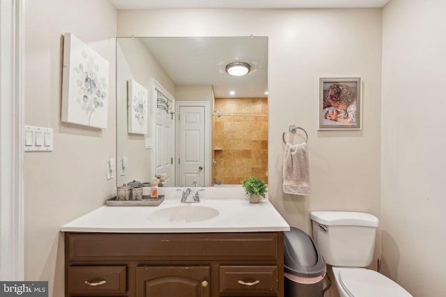 bathroom featuring toilet and vanity