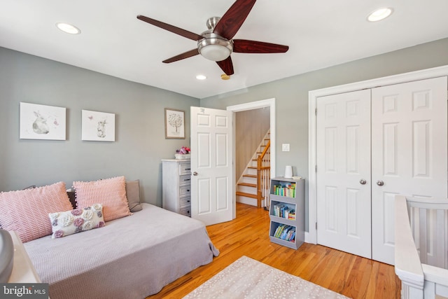 bedroom with light wood-style floors, a closet, ceiling fan, and recessed lighting