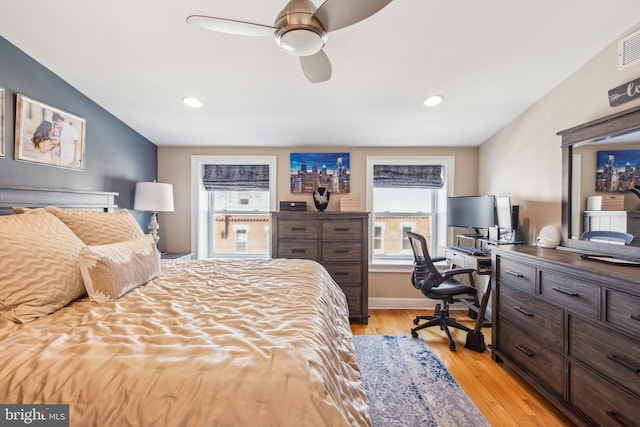 bedroom with visible vents, light wood finished floors, baseboards, recessed lighting, and a ceiling fan