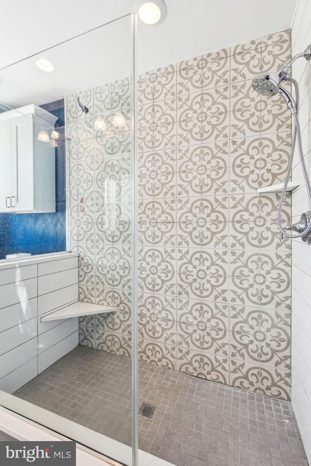 bathroom featuring vanity and walk in shower