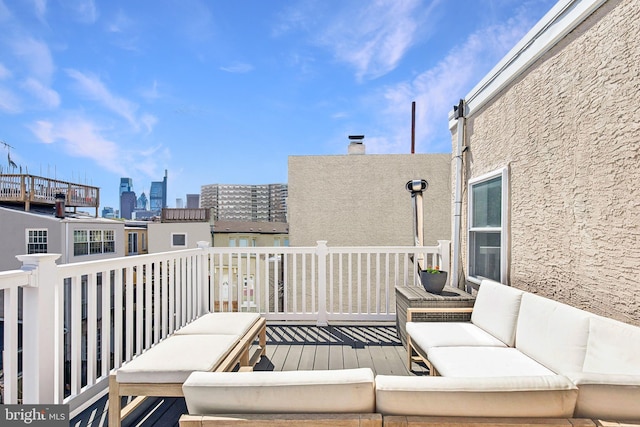 exterior space featuring outdoor lounge area and a city view