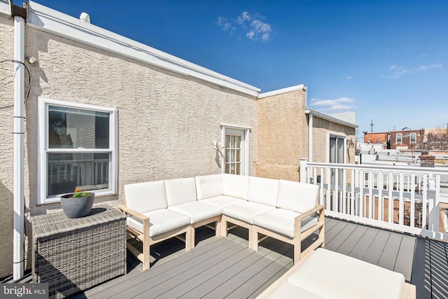 wooden deck featuring an outdoor hangout area