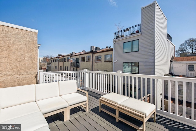 wooden deck featuring an outdoor living space