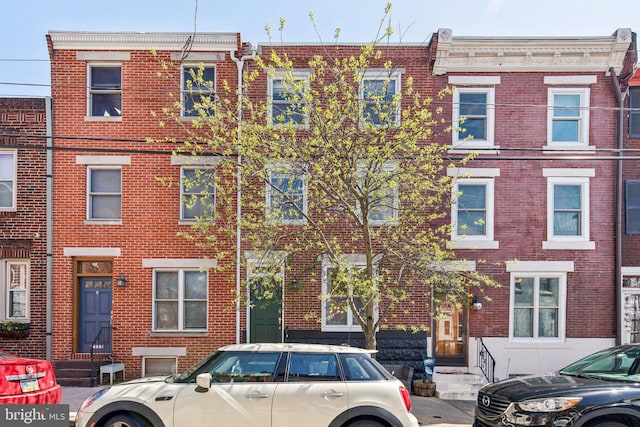 view of property with brick siding