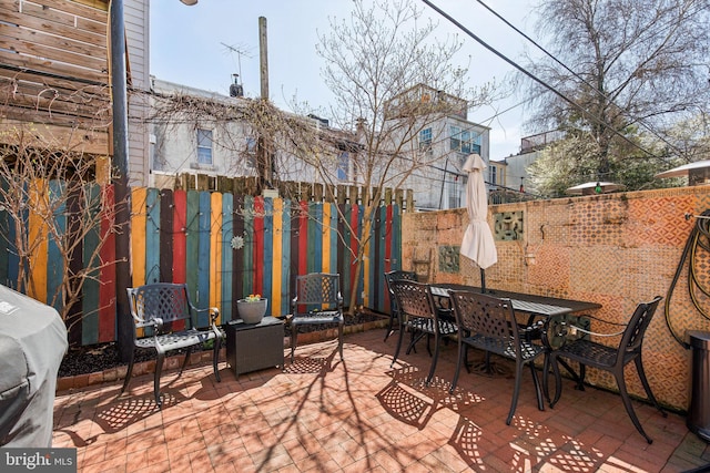 view of patio / terrace with fence and outdoor dining space