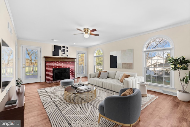 878 Buttermilk Ct, Harrisburg, PA 17111 - living area featuring baseboards, ornamental molding, a fireplace, ceiling fan, and wood finished floors