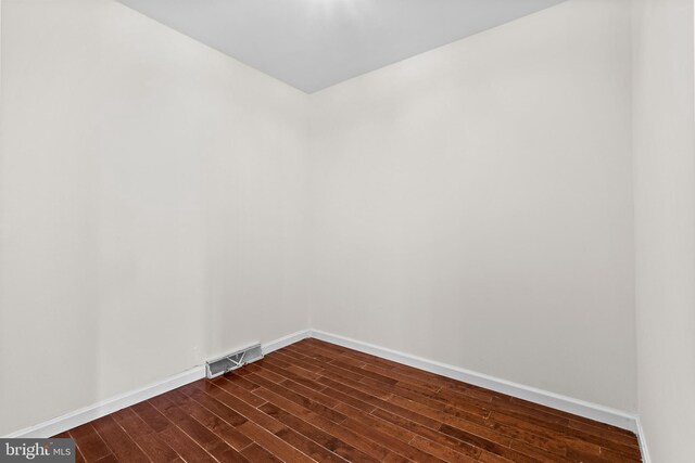 878 Buttermilk Ct, Harrisburg, PA 17111 - empty room featuring baseboards, dark wood finished floors, and visible vents