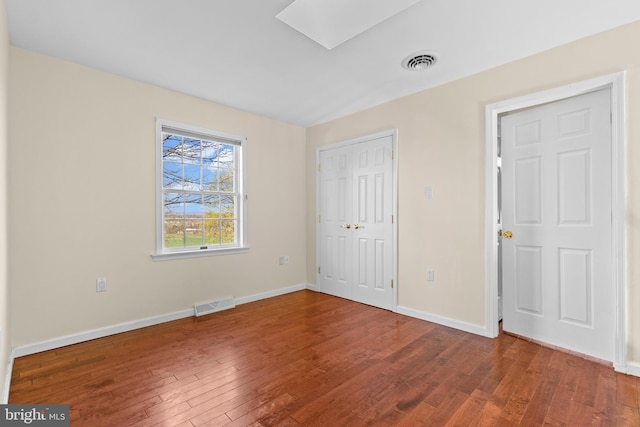 878 Buttermilk Ct, Harrisburg, PA 17111 - unfurnished bedroom with visible vents, baseboards, hardwood / wood-style floors, and a skylight