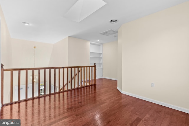 878 Buttermilk Ct, Harrisburg, PA 17111 - unfurnished room featuring visible vents, built in features, baseboards, hardwood / wood-style flooring, and a skylight