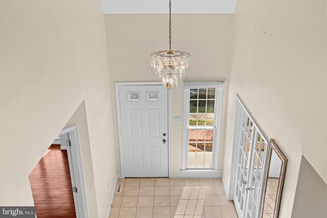 878 Buttermilk Ct, Harrisburg, PA 17111 - tiled entryway featuring baseboards, a notable chandelier, a high ceiling, and french doors
