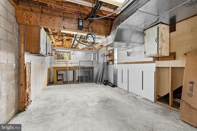 878 Buttermilk Ct, Harrisburg, PA 17111 - garage with a workshop area and concrete block wall