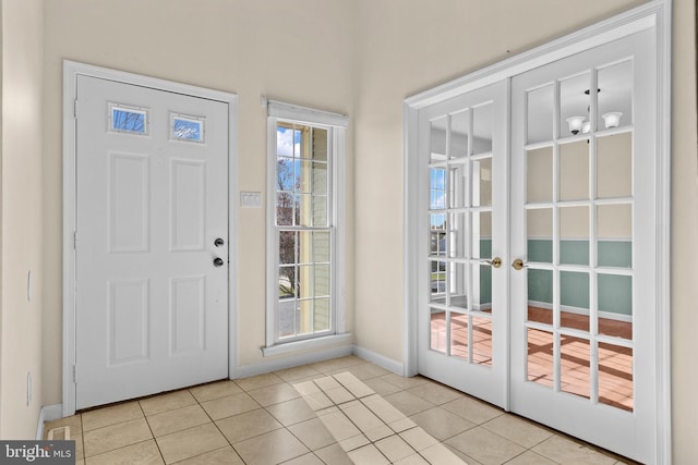 878 Buttermilk Ct, Harrisburg, PA 17111 - foyer entrance with french doors, baseboards, and light tile patterned flooring