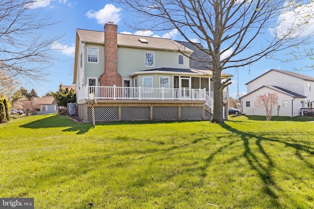 878 Buttermilk Ct, Harrisburg, PA 17111 - rear view of property with a yard, a deck, a sunroom, and a chimney