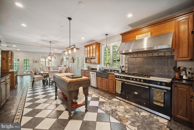 972 Smithbridge Rd, Glen Mills, PA 19342 - kitchen featuring dark countertops, a sink, dishwasher, wall chimney exhaust hood, and double oven range