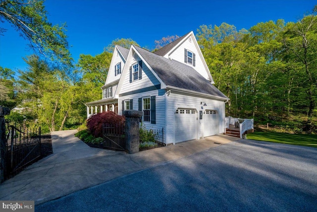 972 Smithbridge Rd, Glen Mills, PA 19342 - view of side of property featuring a shingled roof and aphalt driveway