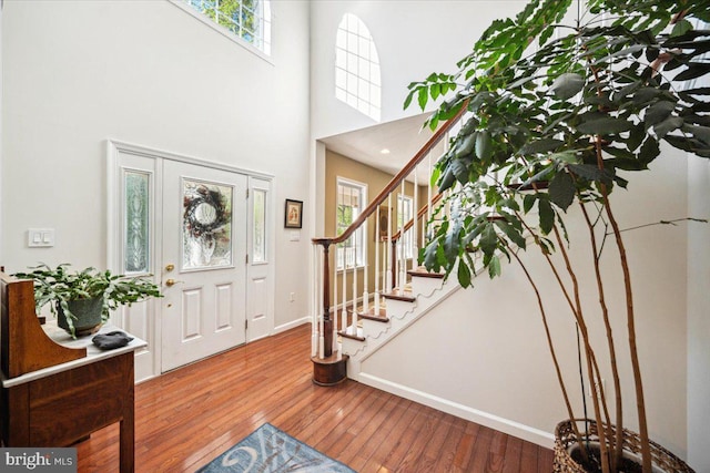 972 Smithbridge Rd, Glen Mills, PA 19342 - foyer entrance featuring wood-type flooring, baseboards, a towering ceiling, and stairs