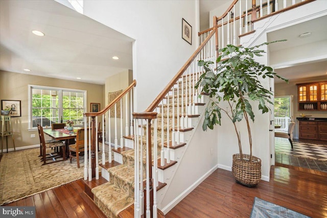 972 Smithbridge Rd, Glen Mills, PA 19342 - stairs with baseboards, recessed lighting, a high ceiling, and hardwood / wood-style flooring