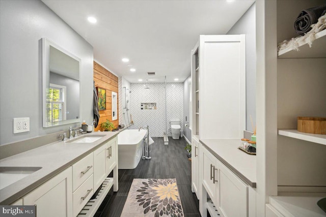 972 Smithbridge Rd, Glen Mills, PA 19342 - full bathroom featuring double vanity, wood finished floors, a soaking tub, a sink, and a stall shower