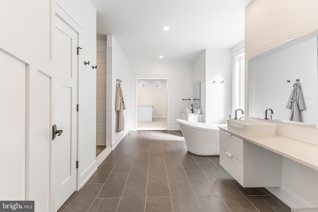 330 Trout Rd, State College, PA 16801 - bathroom with a freestanding bath, vanity, tile patterned flooring, and recessed lighting
