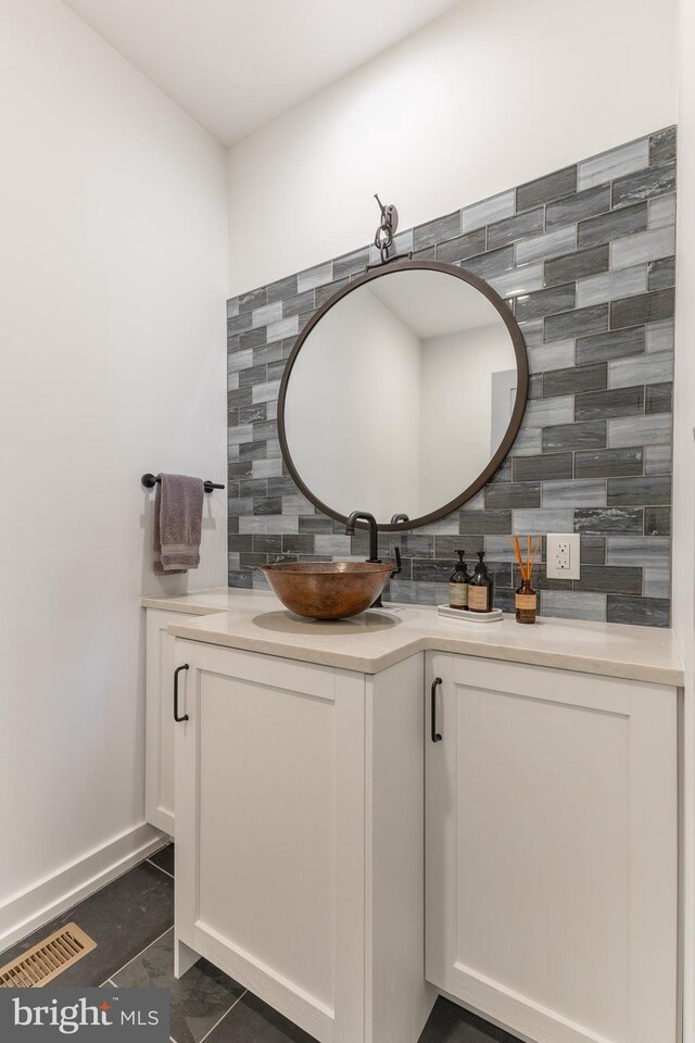 330 Trout Rd, State College, PA 16801 - bathroom featuring visible vents, backsplash, and vanity