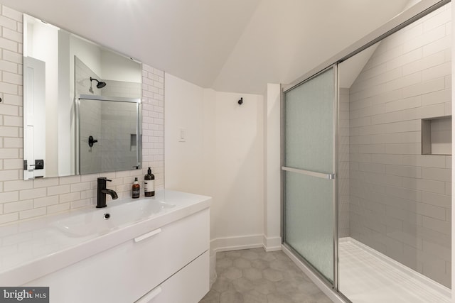 330 Trout Rd, State College, PA 16801 - bathroom featuring a stall shower, vaulted ceiling, vanity, baseboards, and decorative backsplash