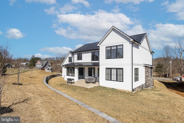 330 Trout Rd, State College, PA 16801 - back of house with a patio, metal roof, board and batten siding, and a yard