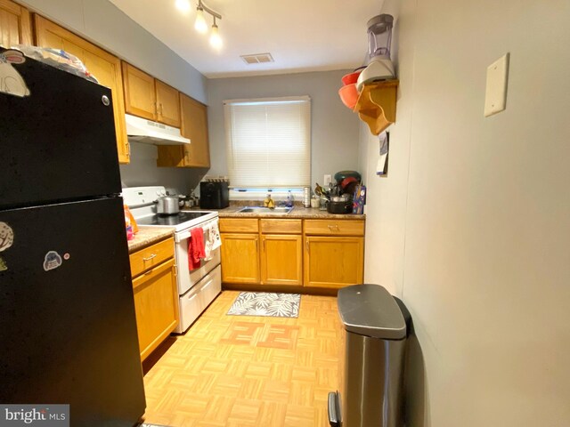 1294 Cooper St Unit B5, Edgewater Park, NJ 08010 - kitchen featuring freestanding refrigerator, under cabinet range hood, visible vents, electric stove, and a sink