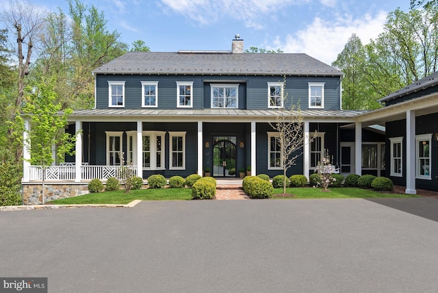 827 Turkey Run Rd, Mclean, VA 22101 - view of front of home with a standing seam roof, a porch, a chimney, and metal roof