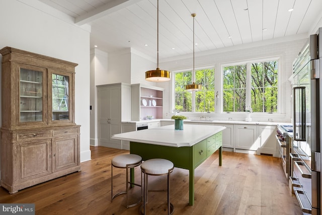 827 Turkey Run Rd, Mclean, VA 22101 - kitchen with a center island, hardwood / wood-style floors, open shelves, a kitchen breakfast bar, and wood ceiling