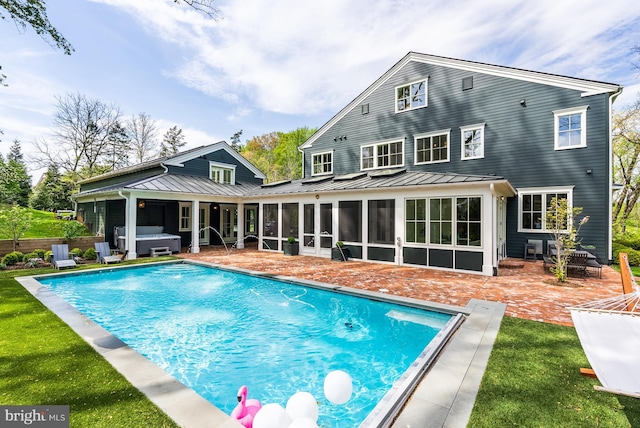 827 Turkey Run Rd, Mclean, VA 22101 - rear view of house featuring a hot tub, a patio, a sunroom, a standing seam roof, and metal roof