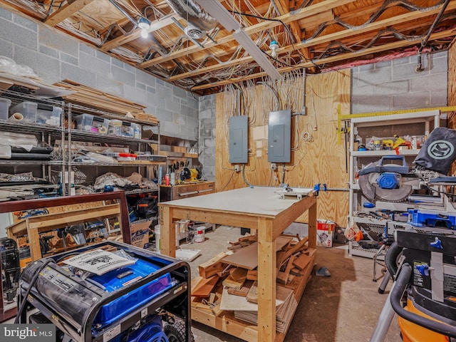 unfinished below grade area with concrete block wall, a workshop area, and electric panel
