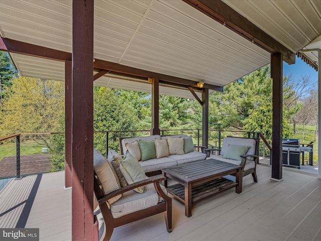 wooden terrace featuring an outdoor hangout area