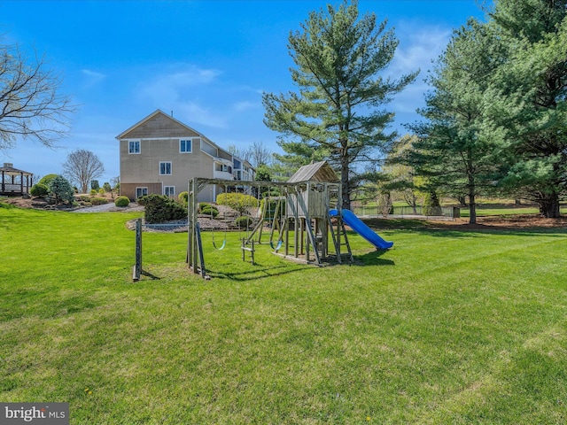 view of jungle gym with a lawn