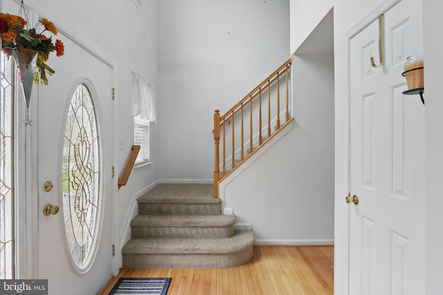 8219 Selwin Ct, Baltimore, MD 21237 - foyer entrance featuring stairway, hardwood / wood-style floors, and baseboards