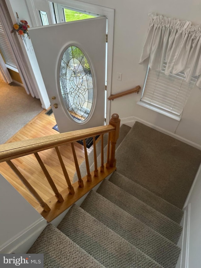8219 Selwin Ct, Baltimore, MD 21237 - staircase with baseboards and carpet floors