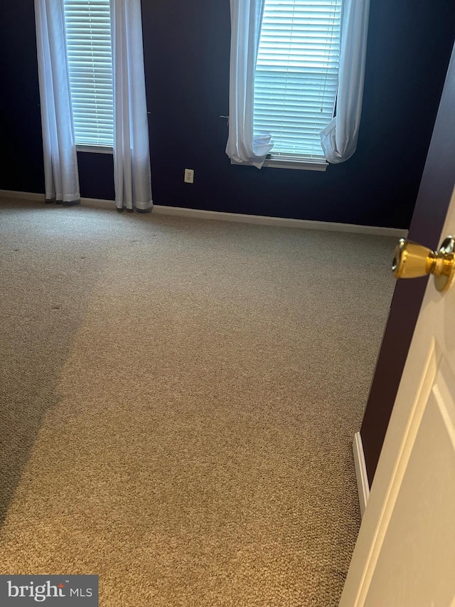8219 Selwin Ct, Baltimore, MD 21237 - carpeted empty room featuring baseboards