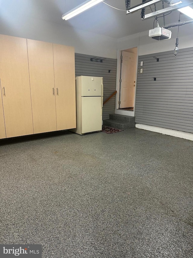 8219 Selwin Ct, Baltimore, MD 21237 - garage featuring freestanding refrigerator and a garage door opener