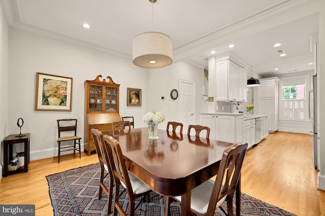 808 Cameron St, Alexandria, VA 22314 - dining area featuring crown molding, light wood finished floors, baseboards, and recessed lighting