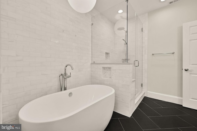 808 Cameron St, Alexandria, VA 22314 - full bathroom with a soaking tub, a stall shower, tile patterned flooring, recessed lighting, and tile walls
