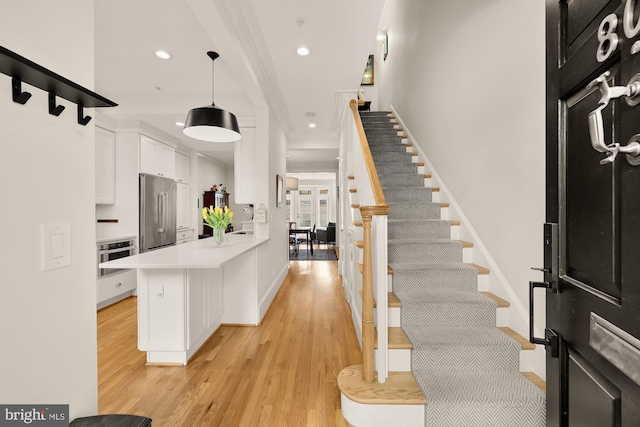 808 Cameron St, Alexandria, VA 22314 - entrance foyer with crown molding, stairs, recessed lighting, light wood-style floors, and baseboards