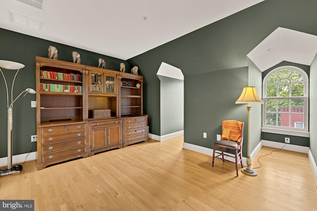 808 Cameron St, Alexandria, VA 22314 - sitting room with light wood-style floors, lofted ceiling, and baseboards